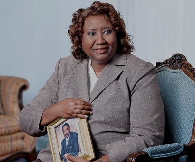 Delores White holds a photo of her late husband Martin.