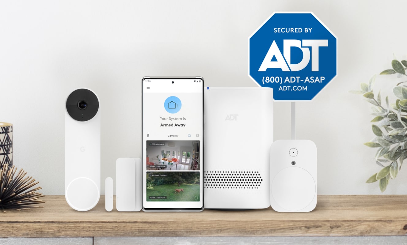 ADT self setup package with a doorbell, cellphone showing the app, hub, yard sign and more