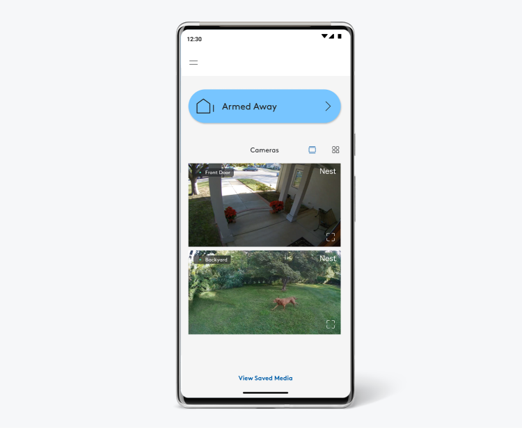 ADT+ app on a mobile phone showing live footage of a person's home ADT+ app on a mobile phone showing live footage of a person's home