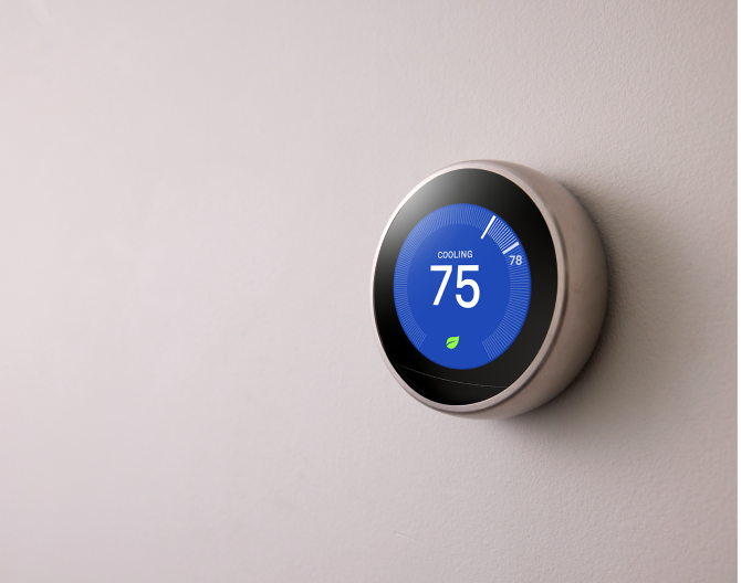 Google Nest Learning Thermostat on a wall