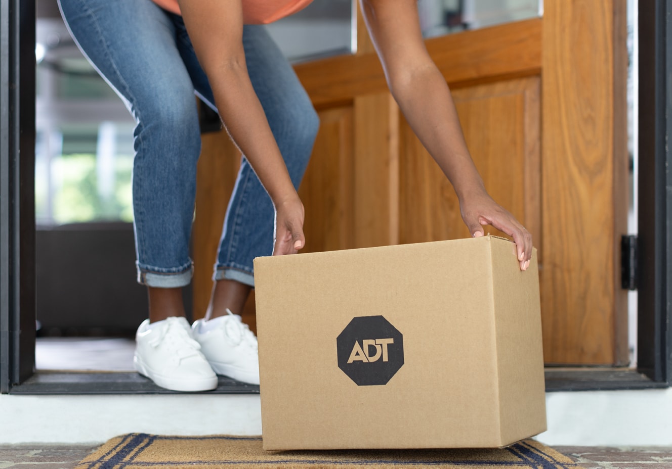 ADT customer getting their ADT package delivered