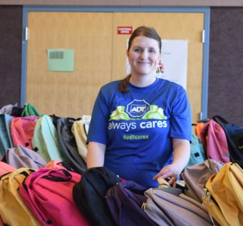 Volunteer wearing an ADT "Always Cares" shirt Volunteer wearing an ADT "Always Cares" shirt