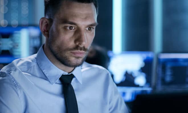 Man with tie looking at computer screen Man with tie looking at computer screen