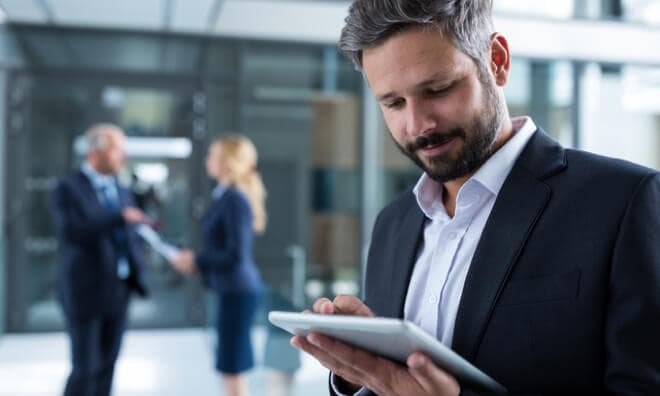 Man looking at iPad Man looking at iPad