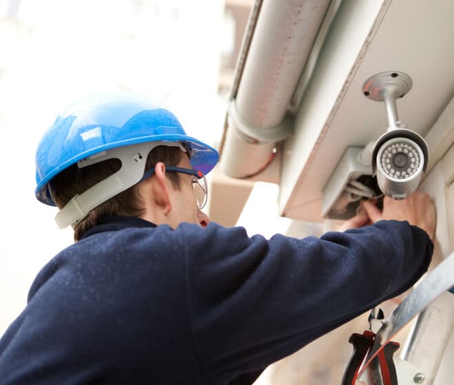 ADT worker installing ADT camera to a home ADT worker installing ADT camera to a home