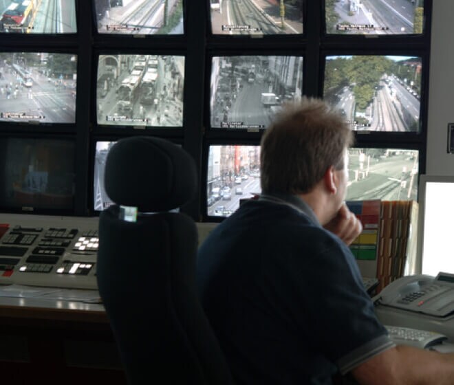 Security office watches surveillance videos Security office watches surveillance videos
