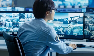 Security guard looking at footage Security guard looking at footage