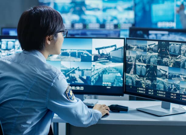 Security guard looking at footage Security guard looking at footage