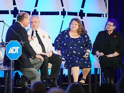 Nancy Carol and Chief Daughtery on stage with Eileen and Bob Tucker from ADT 
