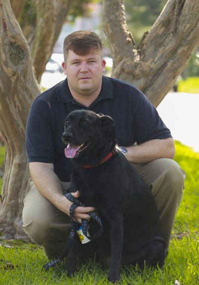 Chris Sacra and his dog Sophie.