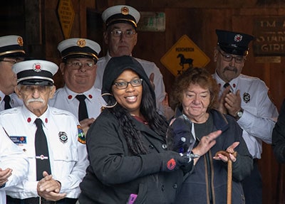 Members of the Sunapee Fire Department along with Barb Dulling and the ADT call center agent.