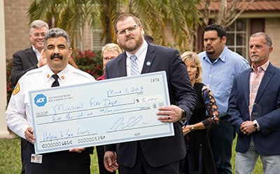 The Mission Fire Department was presented with two $5,000 checks, one from ADT and one from the USAA.