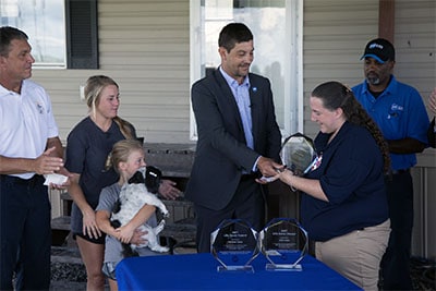 Jason Shockley, ADT Vice President of Corporate Communications  presents LifeSaver Awards to ADT employees.