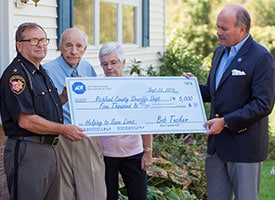 Richland County Sheriff's Department  recieves a $5,000 check from ADT.