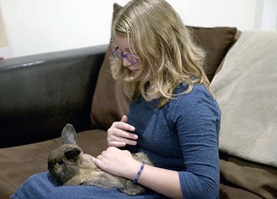 The McFall's daughter Zoe with her pet rabbit.