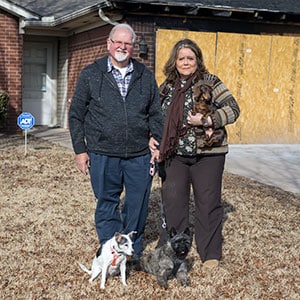Gene and Linda Mendicki with their three dogs.