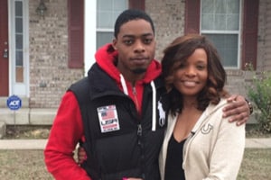 ADT Customer Tabitha Taylor and her son, Jerrel Wilson, outside their St. Louis home which was the scene of a fire.