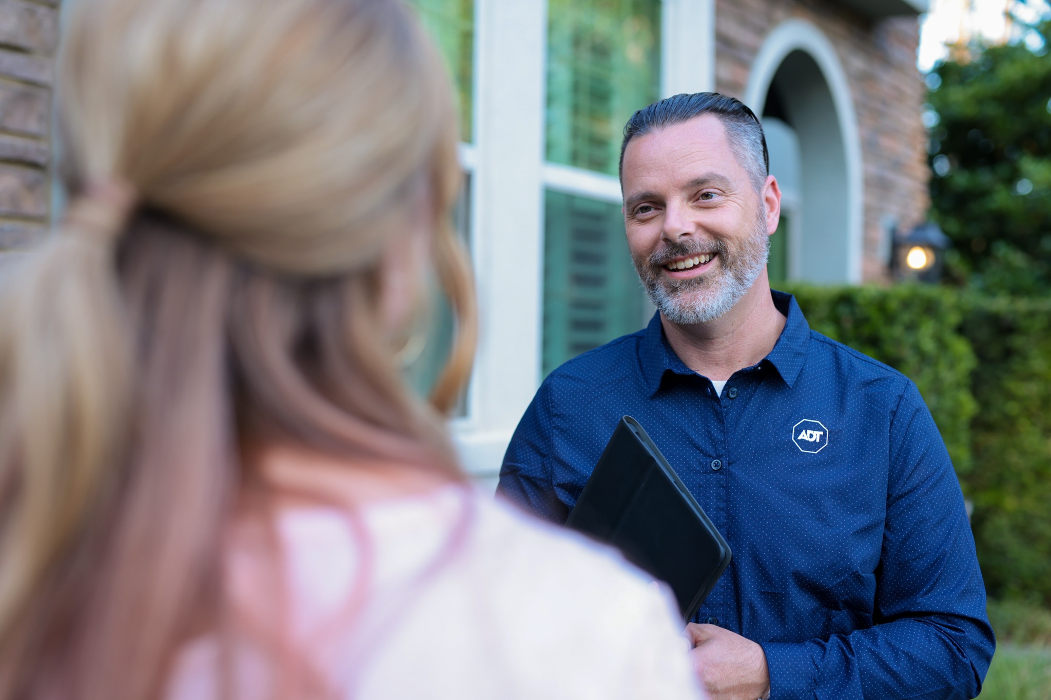 ADT installer talking to a customer