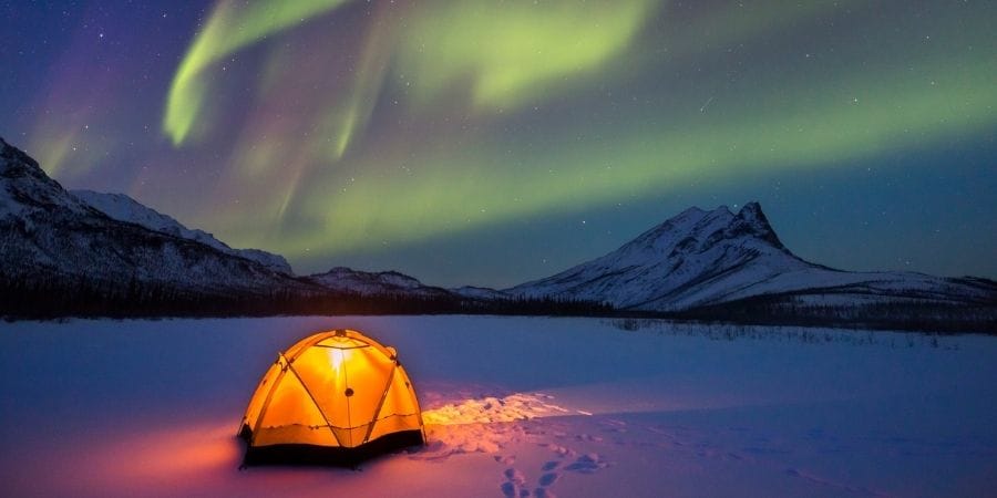 camping under northern lights in alaska