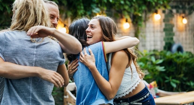 9 Unique Going Away Gifts for Friends Moving Away Friends hugging each other before they move away