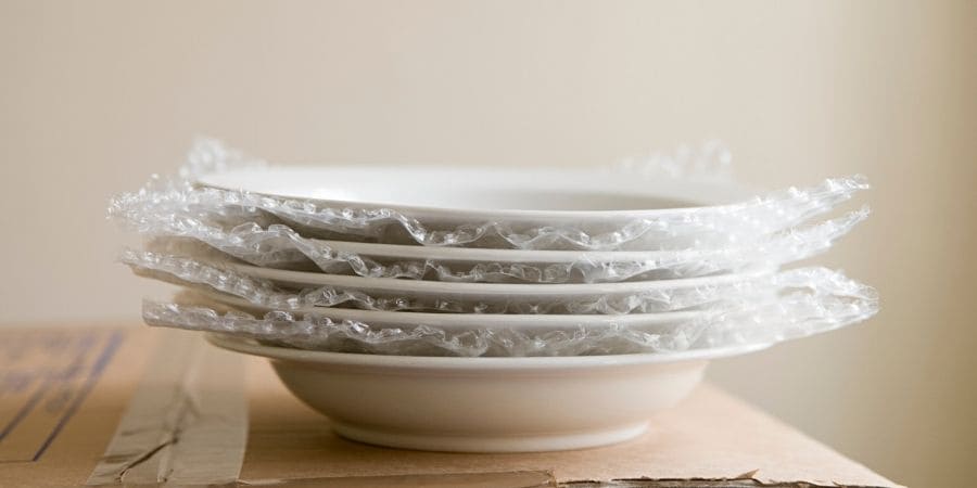 Plates wrapped in bubble wrap for move