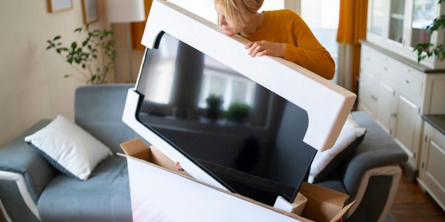 TV being packed in original box