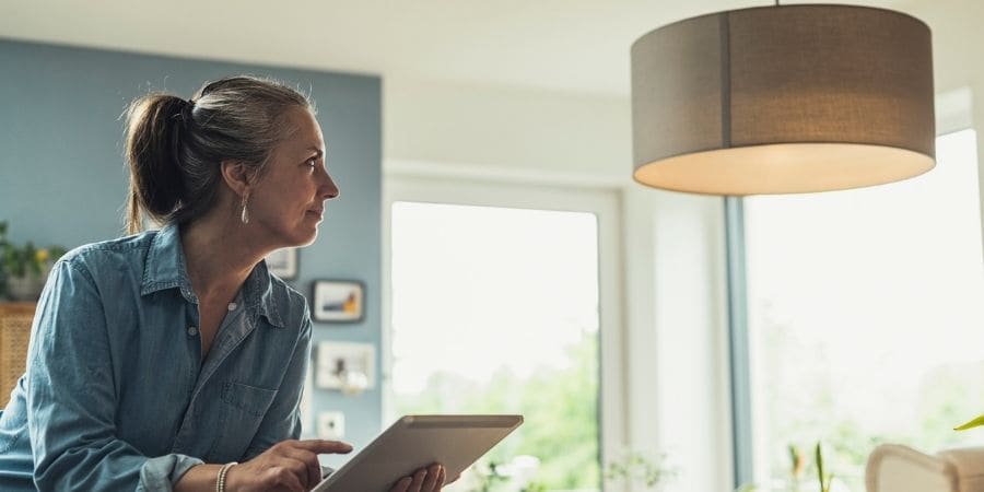 Woman with tablet in smart home