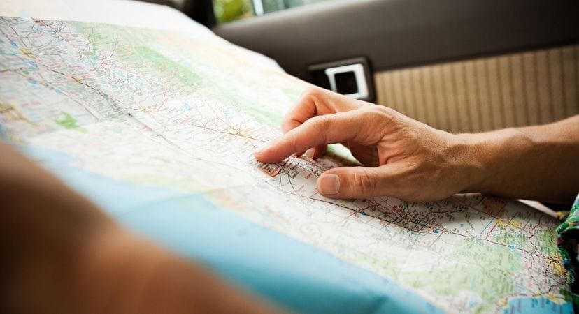 7 Things to Consider when Moving to Another State Hand on a paper map