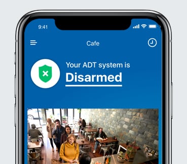 ADT app on phone showing security footage ADT app on phone showing security footage