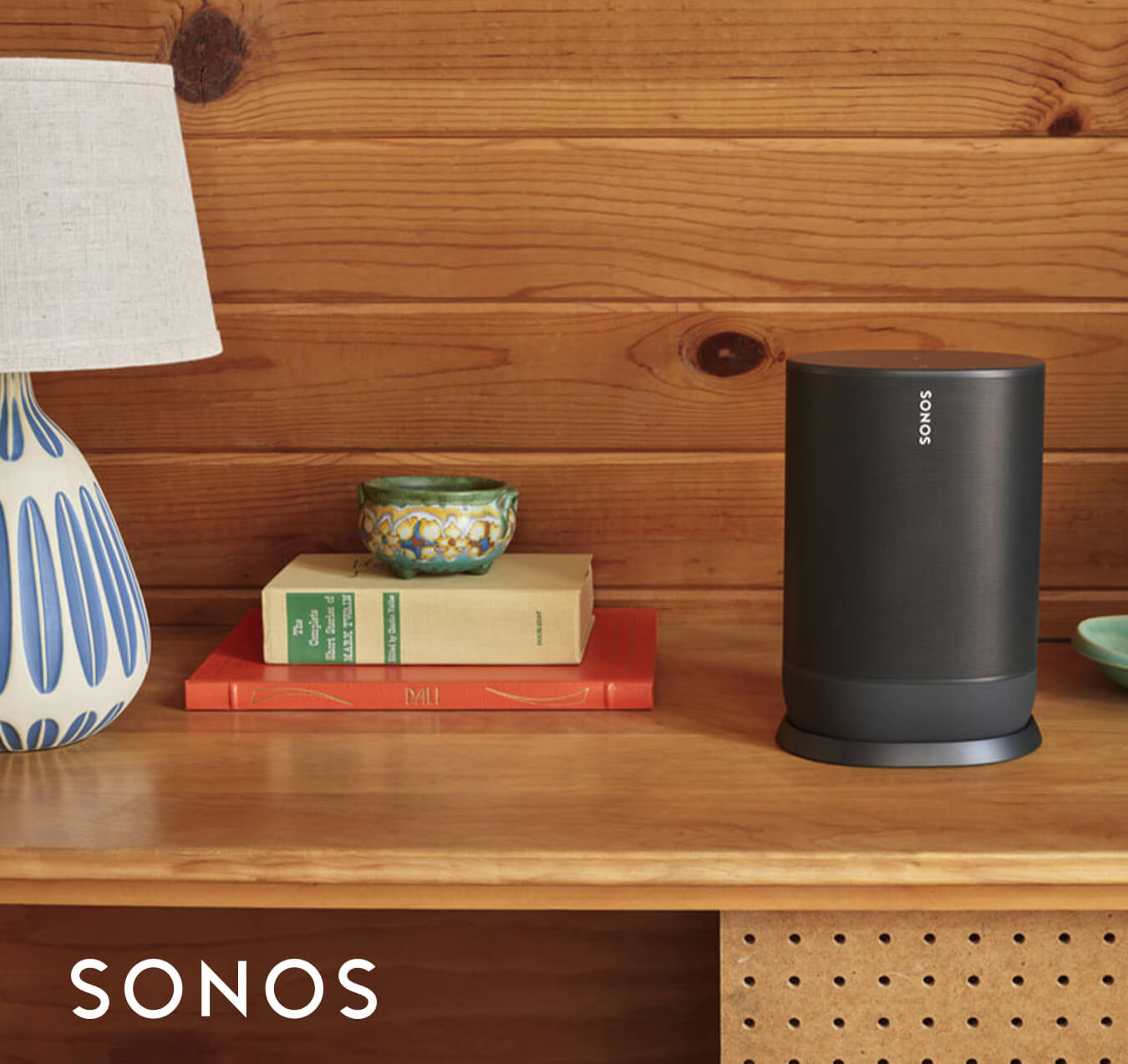 Sonos smart speaker on top of a dresser Sonos smart speaker on top of a dresser