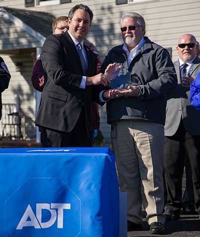 ADT presented the dispatcher with the lifesaver award.