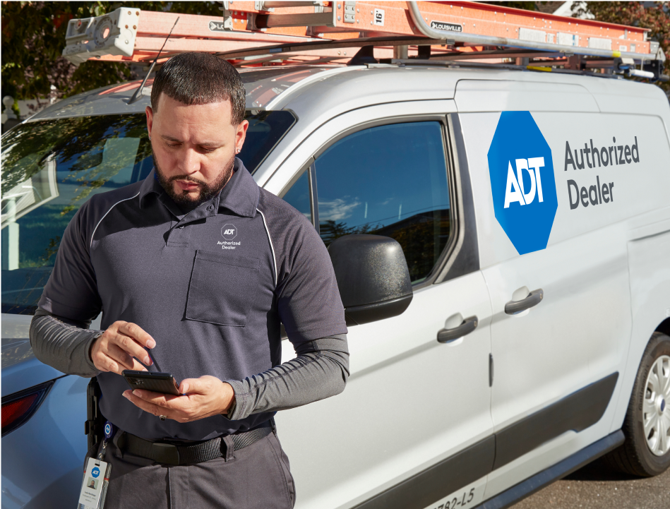 ADT installer next to van ADT installer next to van