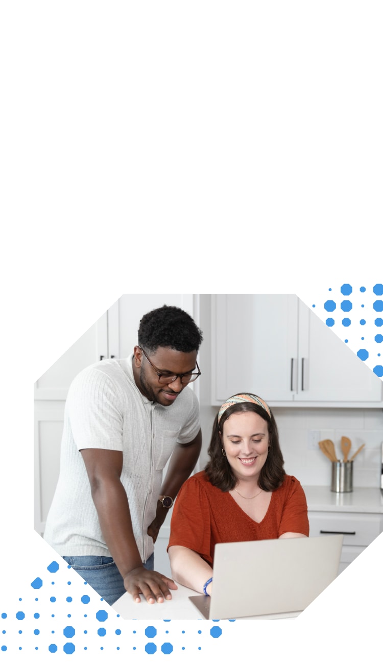 Women and man looking at their laptop