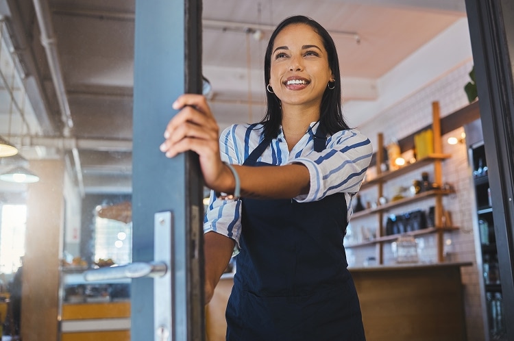 ADT consultation in someone's home showcasing the ADT Command Panel and ADT Indoor Camera