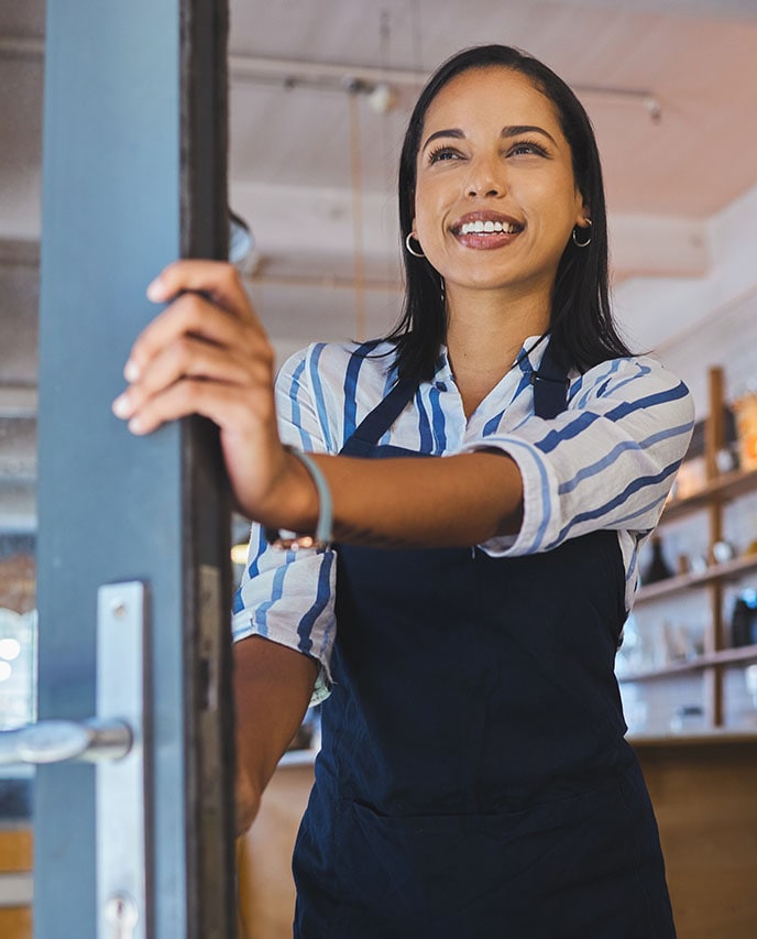 ADT consultation in someone's home showcasing the ADT Command Panel and ADT Indoor Camera