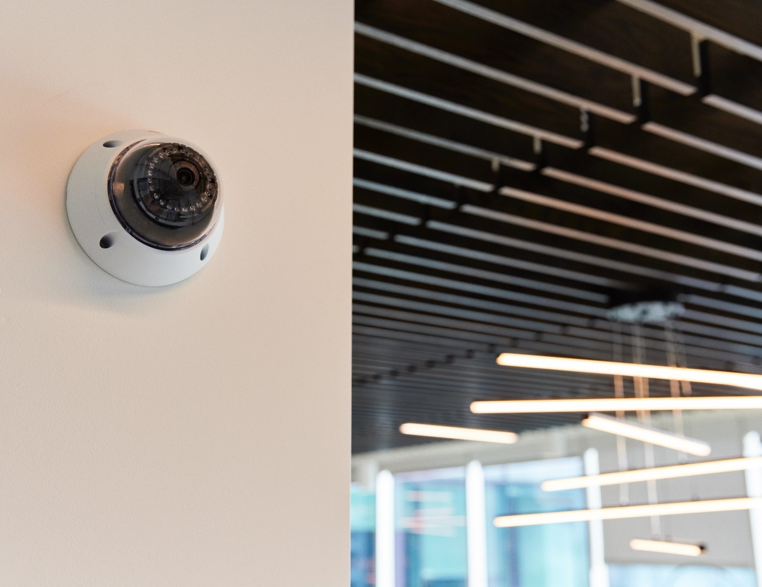 Woman consults with two customers on security solutions