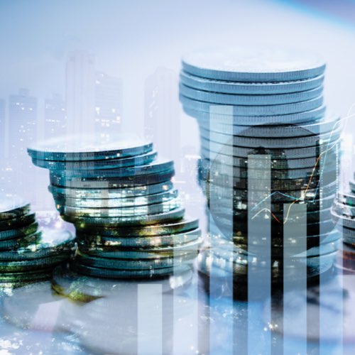 Superimposed cityscape, bar char and stacked coins