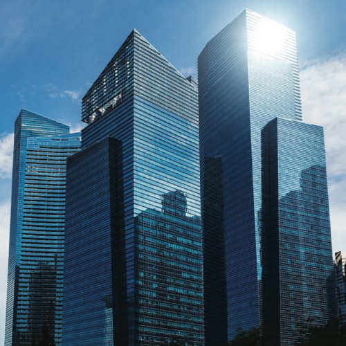 Cluster of skyscrapers reflecting the sun