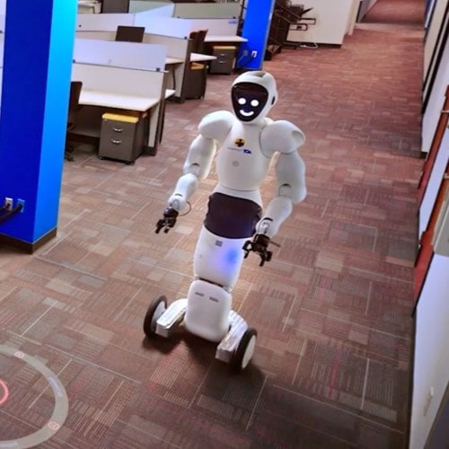 EvoGuard by ADT Commercial robot patrolling hallway