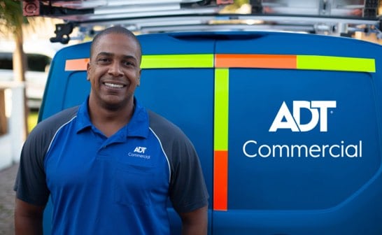 ADT technician at the back of an ADT van