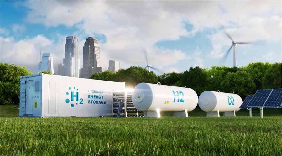 Energy storage containers in grassy field with skyscrapers in background