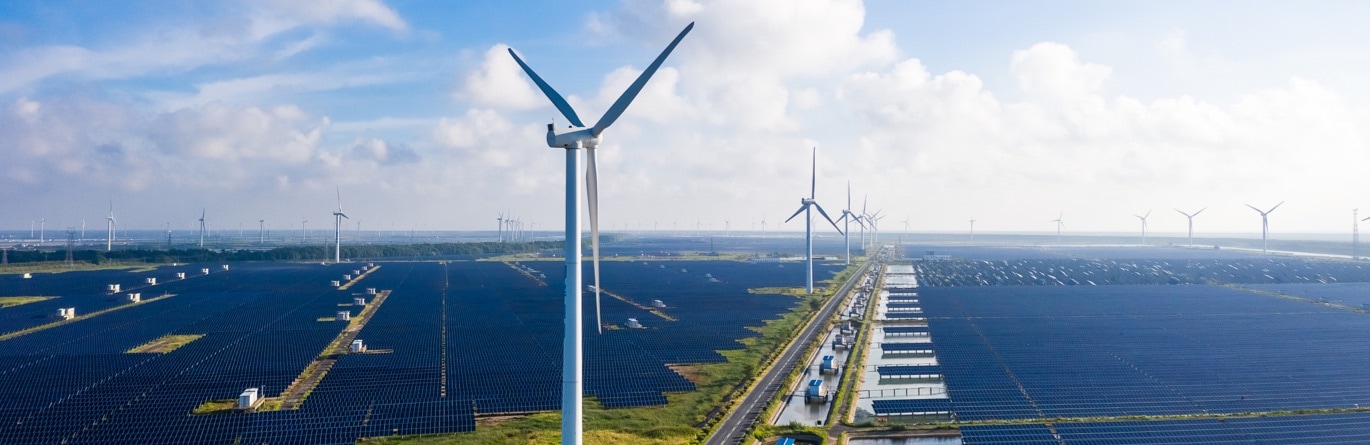 Huge wind and solar farm vista extending to horizon