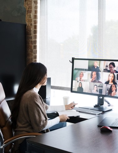 Woman in office on conference call