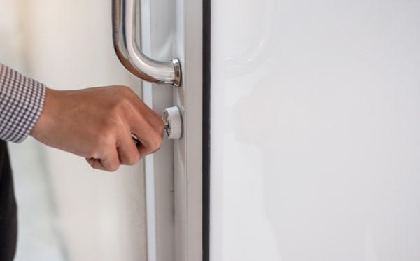 Person unlocking a door