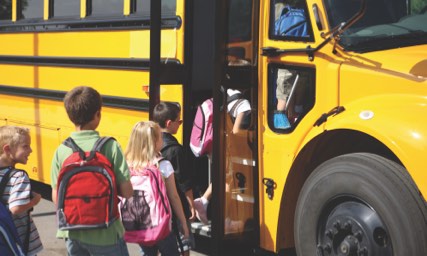 Children boarding a school bus