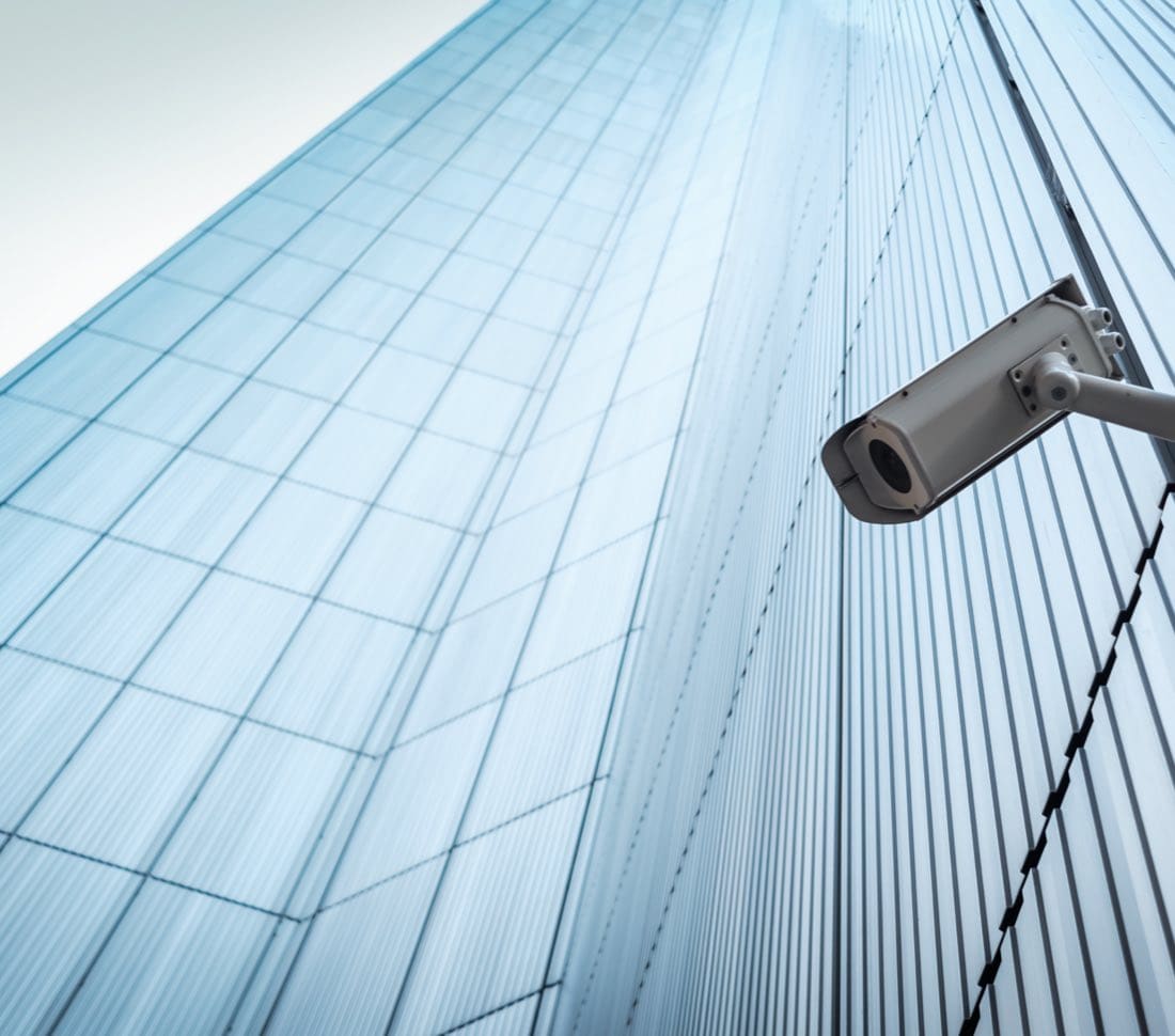 Video monitoring camera on side of skyscraper