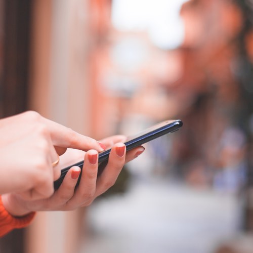 Hands manipulating a smart phone