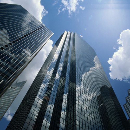 View of mirror-clad highrise office buildings and sky
