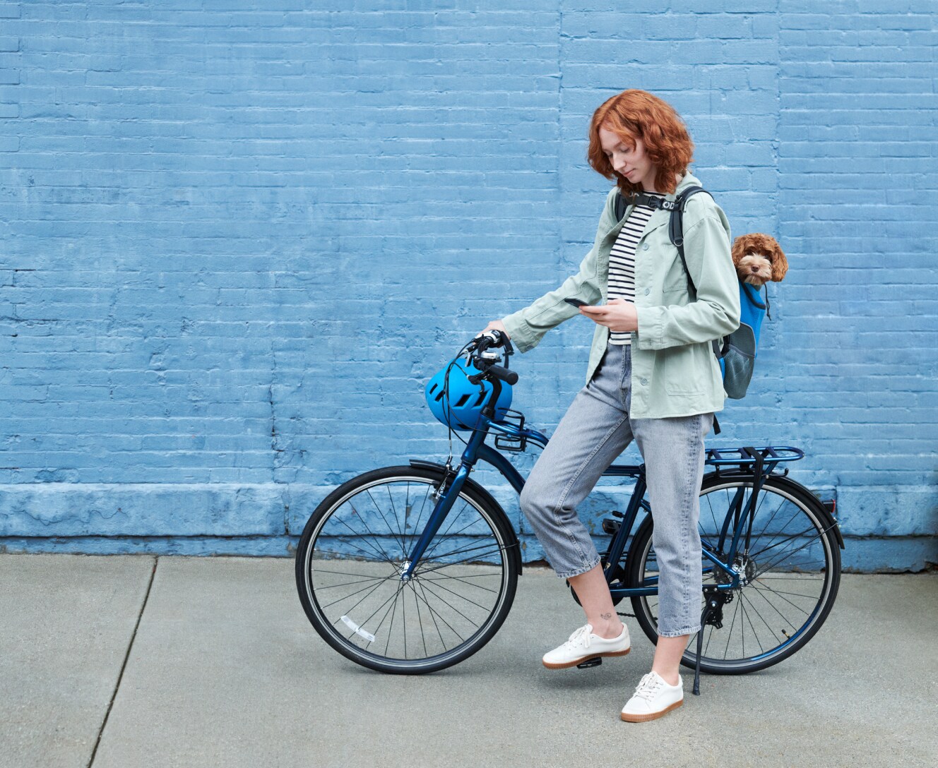 Woman on a bike using her ADT app Woman on a bike using her ADT app