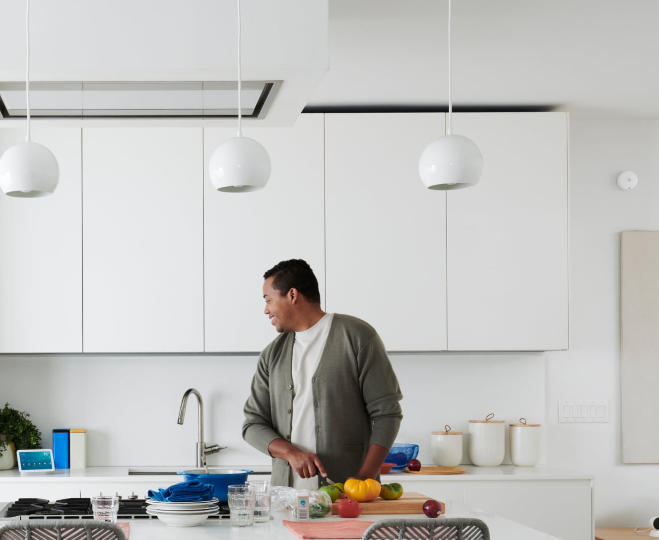 Man in kitchen using the ADT command panel Man in kitchen using the ADT command panel